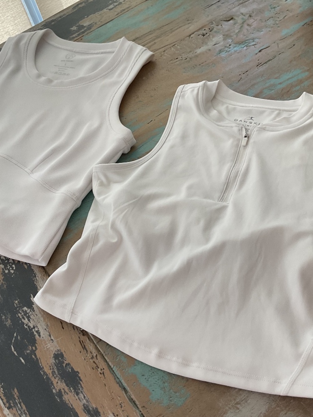 Two summer sleeveless white tops